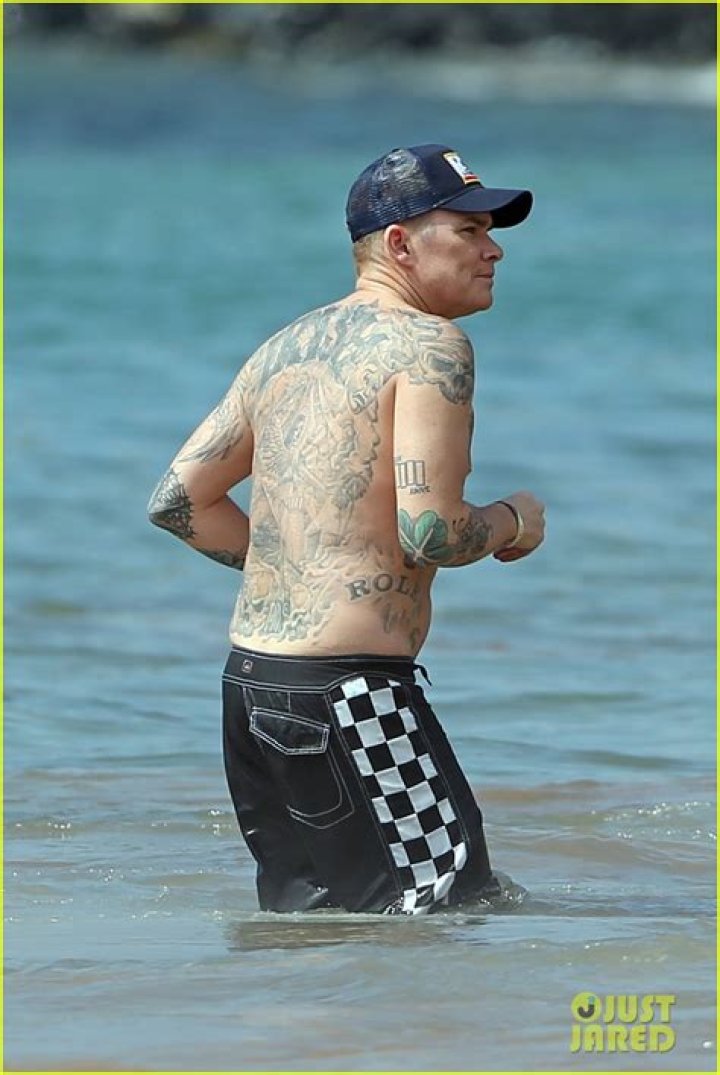 Angus Young: Wife, net worth, tattoos, smoking & body facts